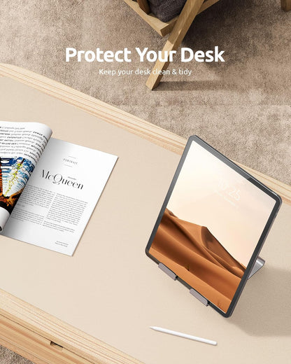 Tablet on a desk with a magazine, text 'Protect Your Desk' displayed.